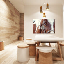 Picture of a pinto horse on the wall of a wooden room